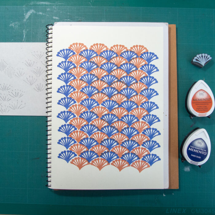 a block printed pattern on a sketchbook, used inks and a doodle